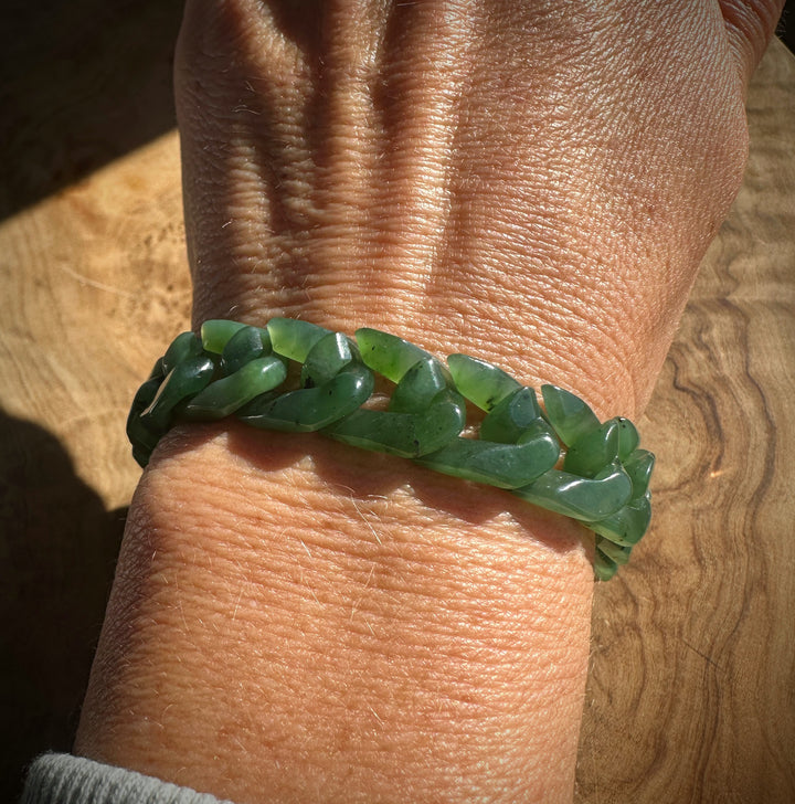 Chunky green nephrite bead bracelet wrapped around the wrist