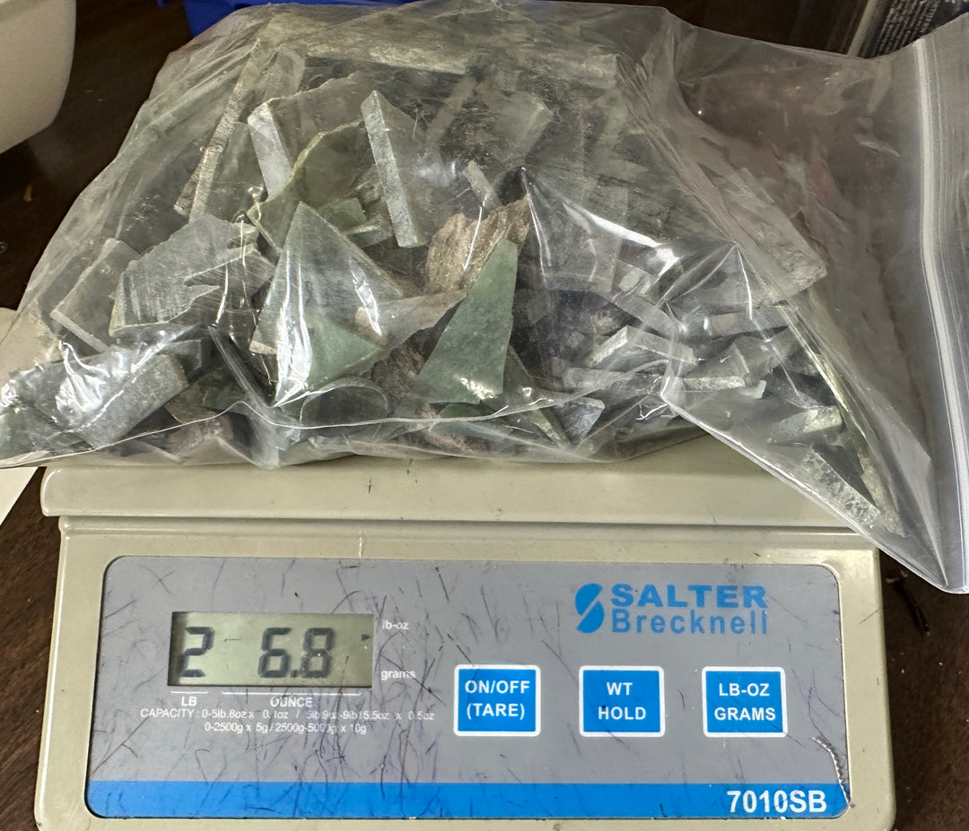 Bag of green jade chips on a scale - 2lbs 6.8oz