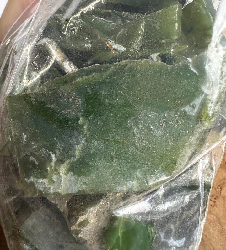 close up of green jade in a bag