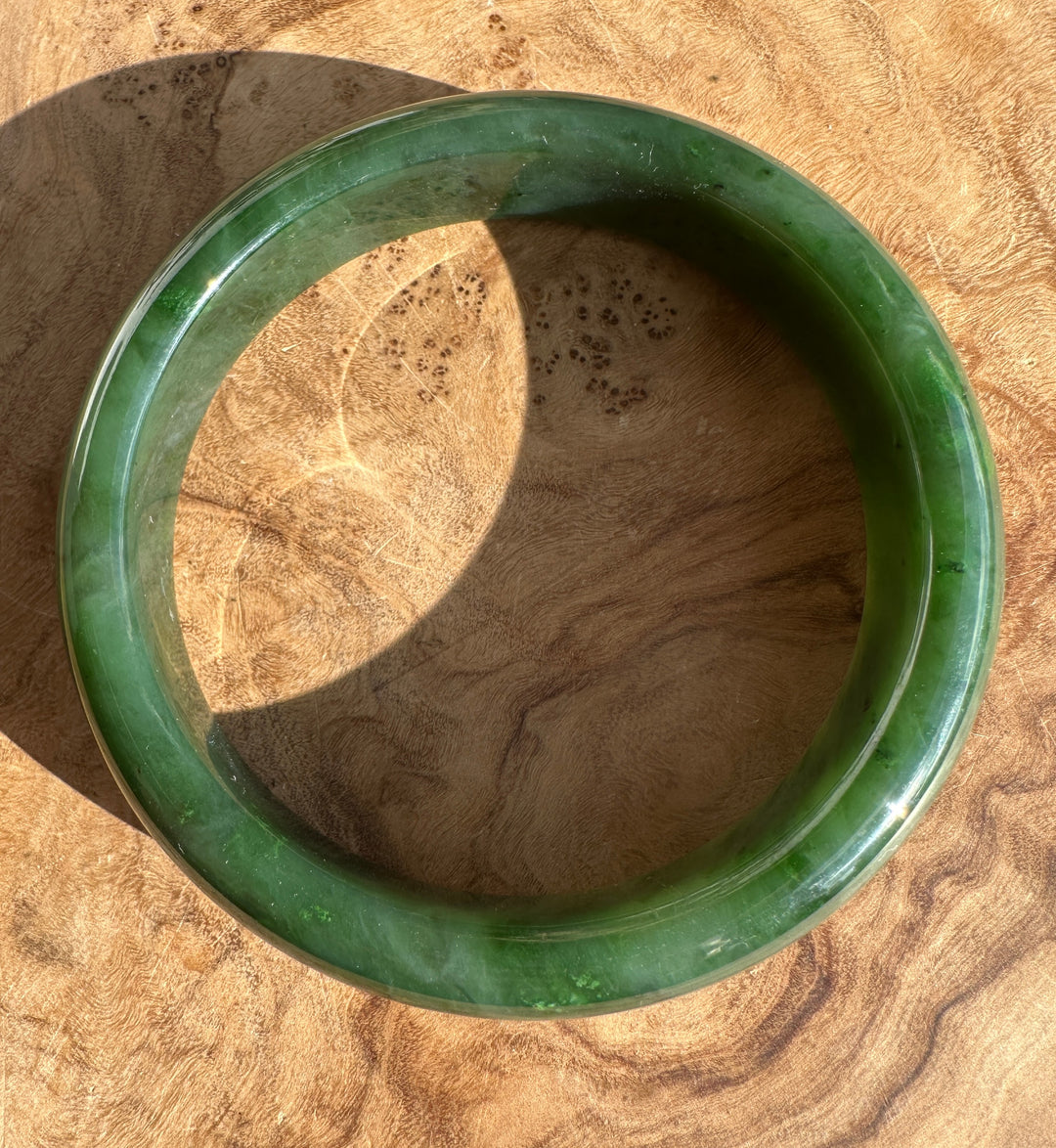 Inside edge of the Canadian Jade Bangle 59.8 x 14.5mm, showing smooth interior and deep green color.