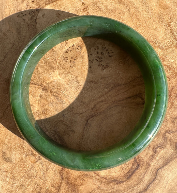 Inside edge of the Canadian Jade Bangle 59.8 x 14.5mm, showing smooth interior and deep green color.