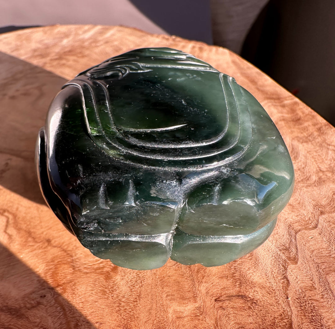 Close-up of the jade carving highlighting smooth curves of the rider on the elephant