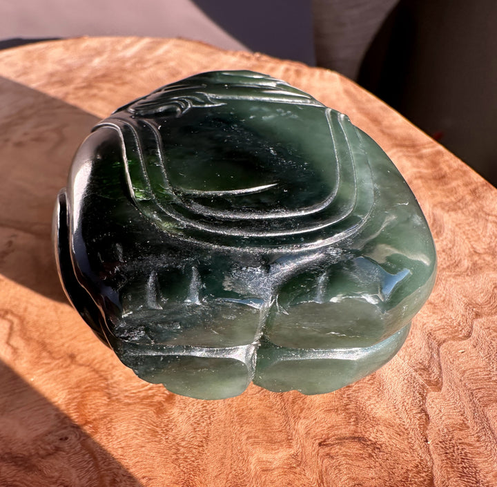 Close-up of the jade carving highlighting smooth curves of the rider on the elephant