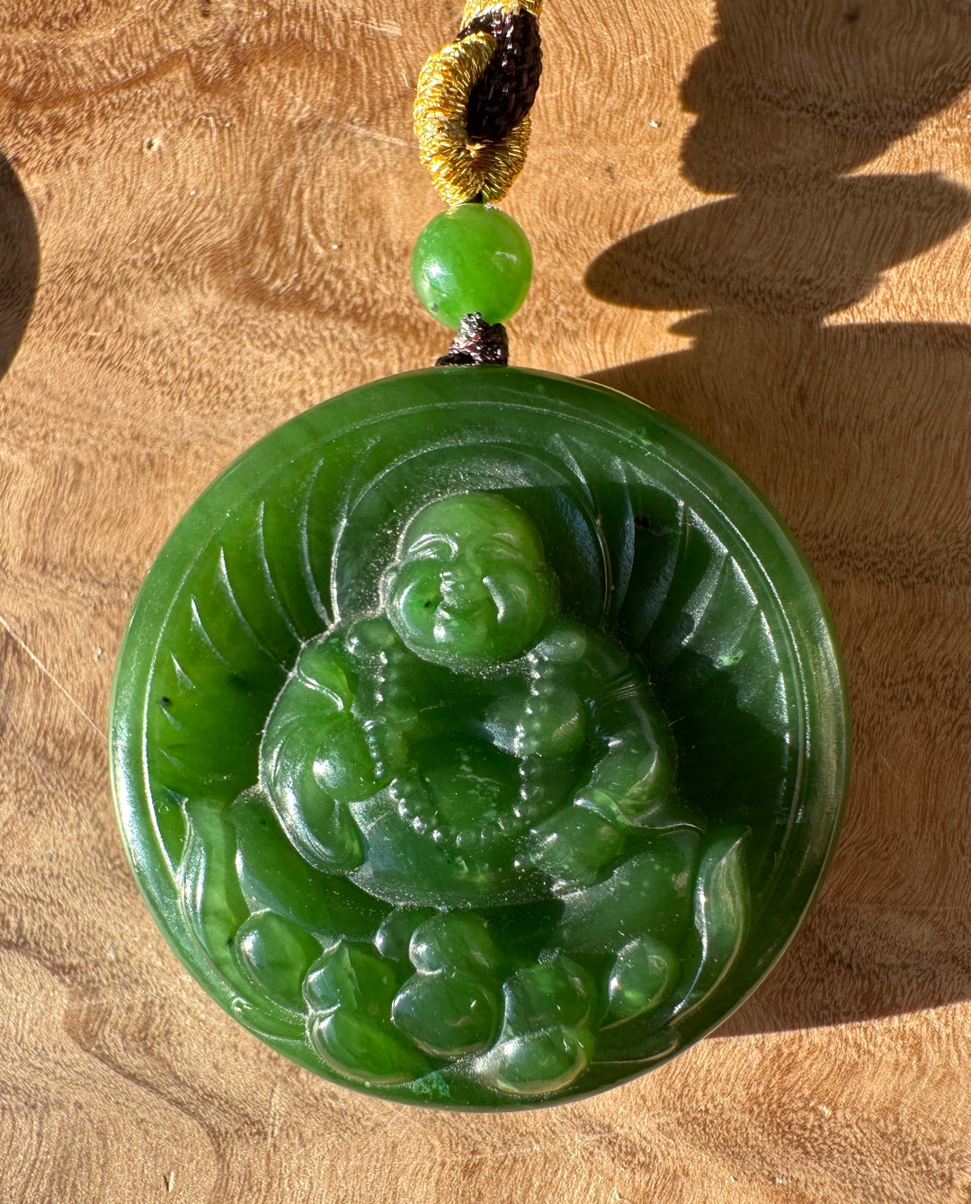 AA Canadian nephrite jade Buddha lotus pendant with a round green bead over a carved lotus disk