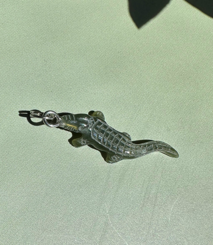 Dark green jade alligator charm with a metal loop for pendant