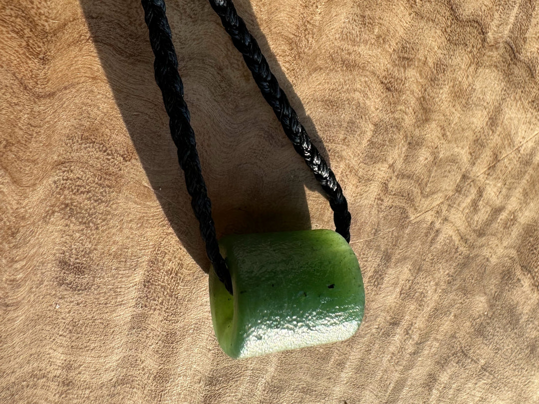 Canadian Jade textured bead pendant 12x14mm on a black braided cord
