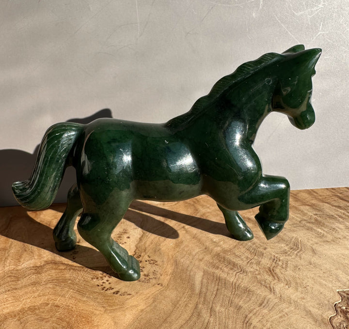 Canadian nephrite jade horse 5 inch sculpture in dark green with a glossy finish and flowing mane
