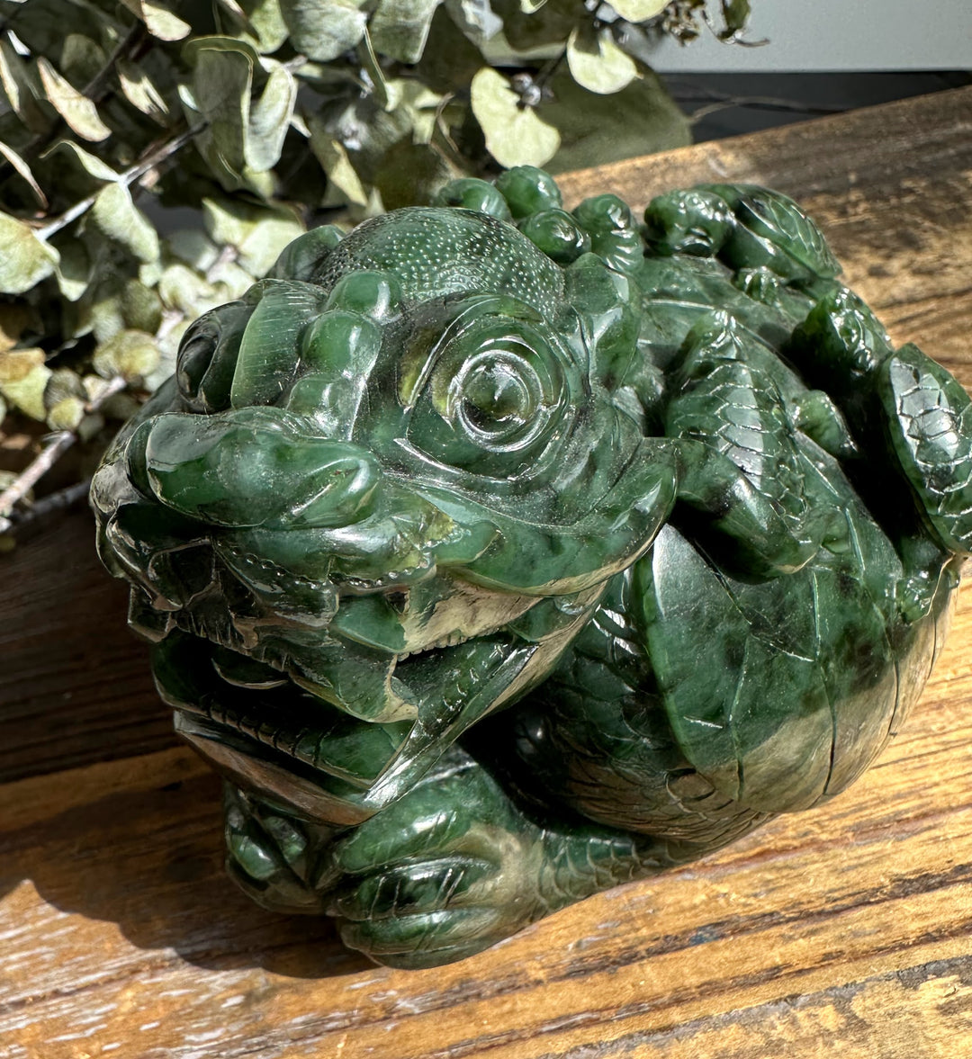 Close-up of the jade dragon turtle head with an open mouth and detailed scales