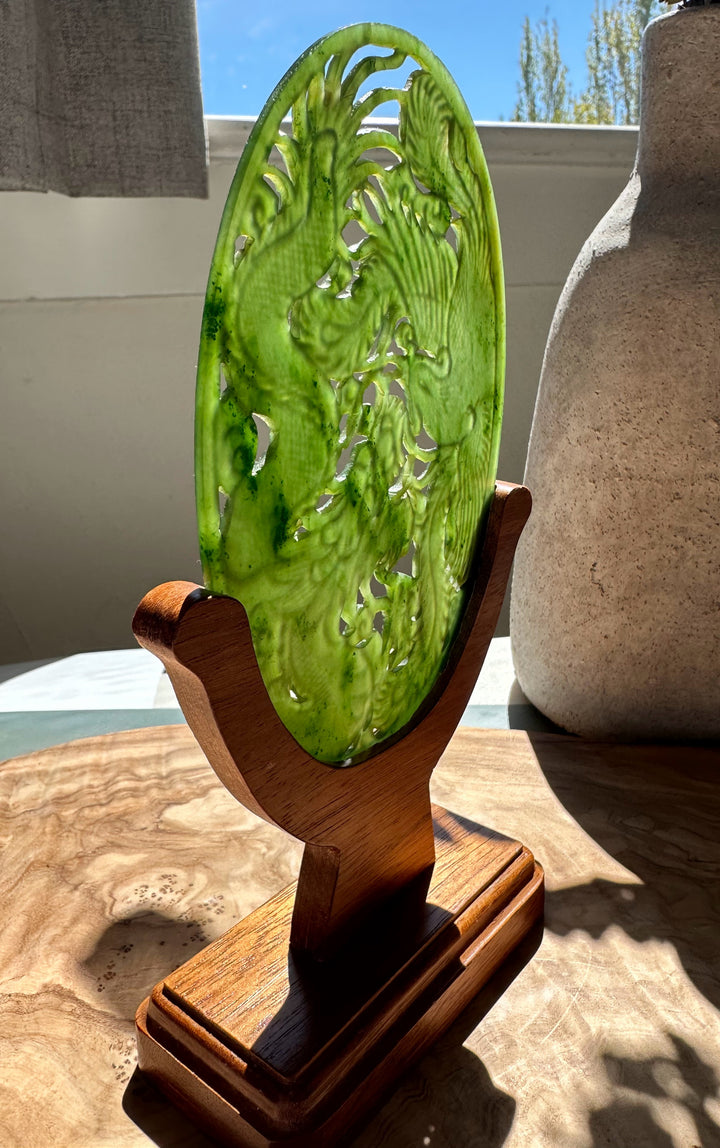 Side view of the jade dragon and phoenix oval screen on a wooden base