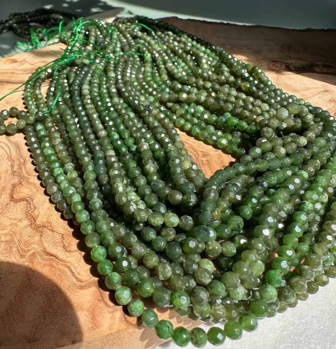 Green faceted 4mm beads in multiple unstrung strands