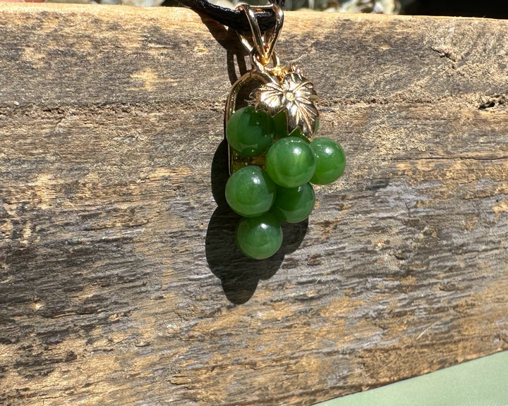 Vintage Jade Grape Pendant with a cluster of green jade beads and a gold leaf bail