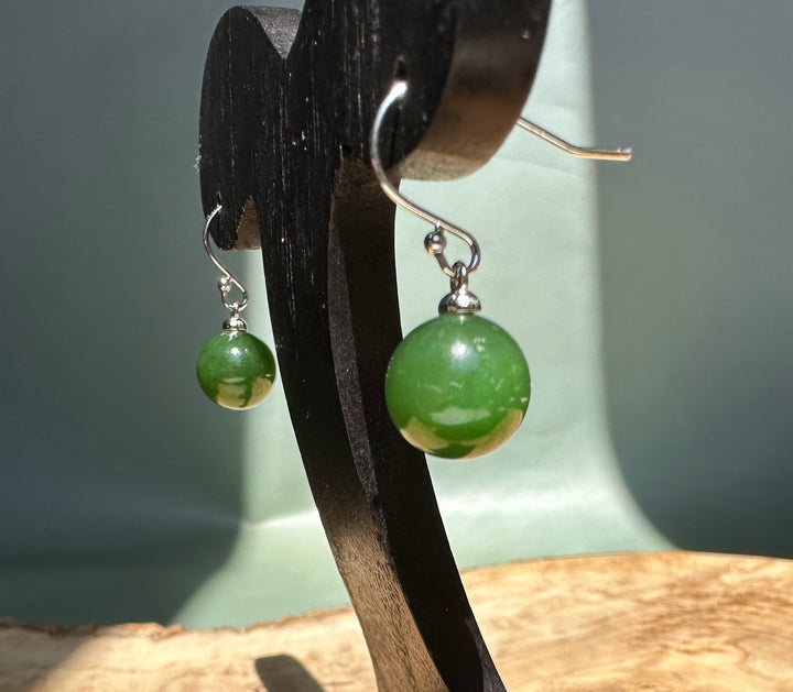 Close up of Canadian Jade Earrings featuring green jade beads on silver hooks