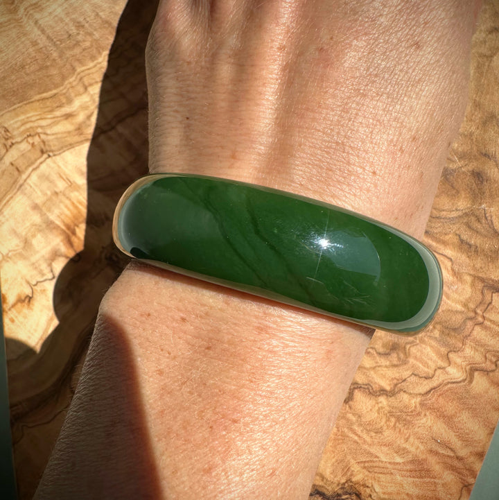 AA Canadian Jade Bangle on wrist, smooth deep green 60 by 19 mm.