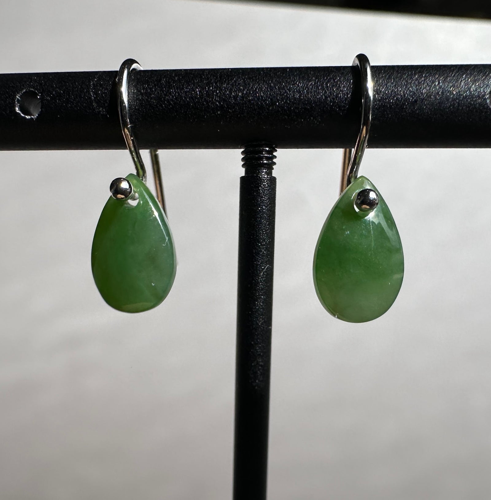 Green jade teardrop earrings on silver hooks