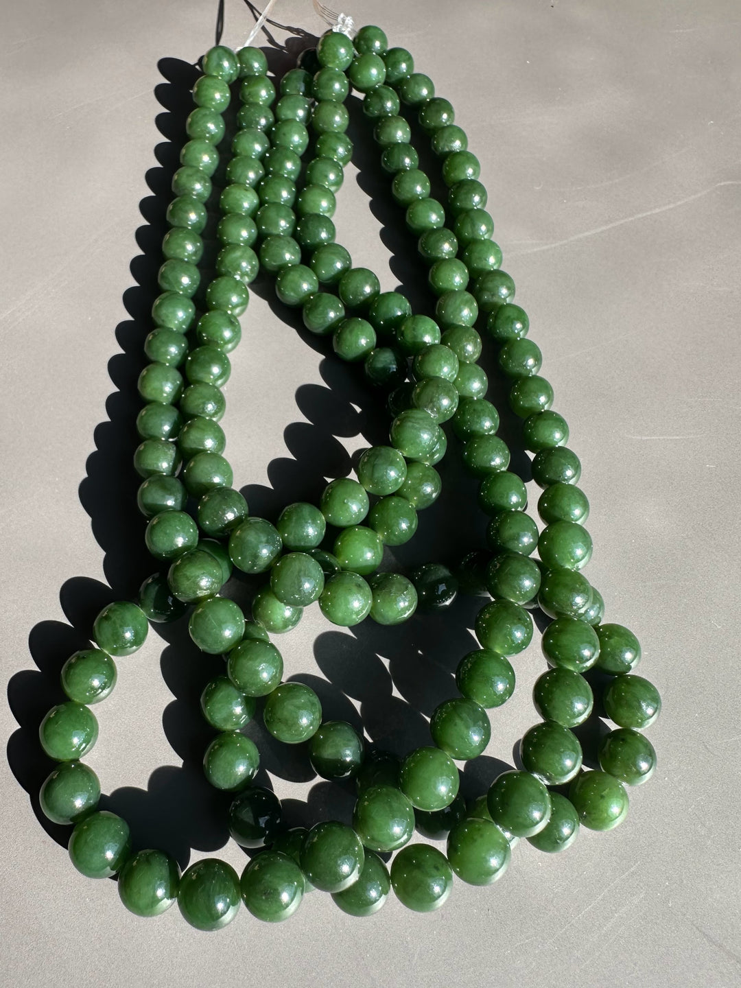 Dark green 8mm Canadian unstrung beads on 16 inch strands