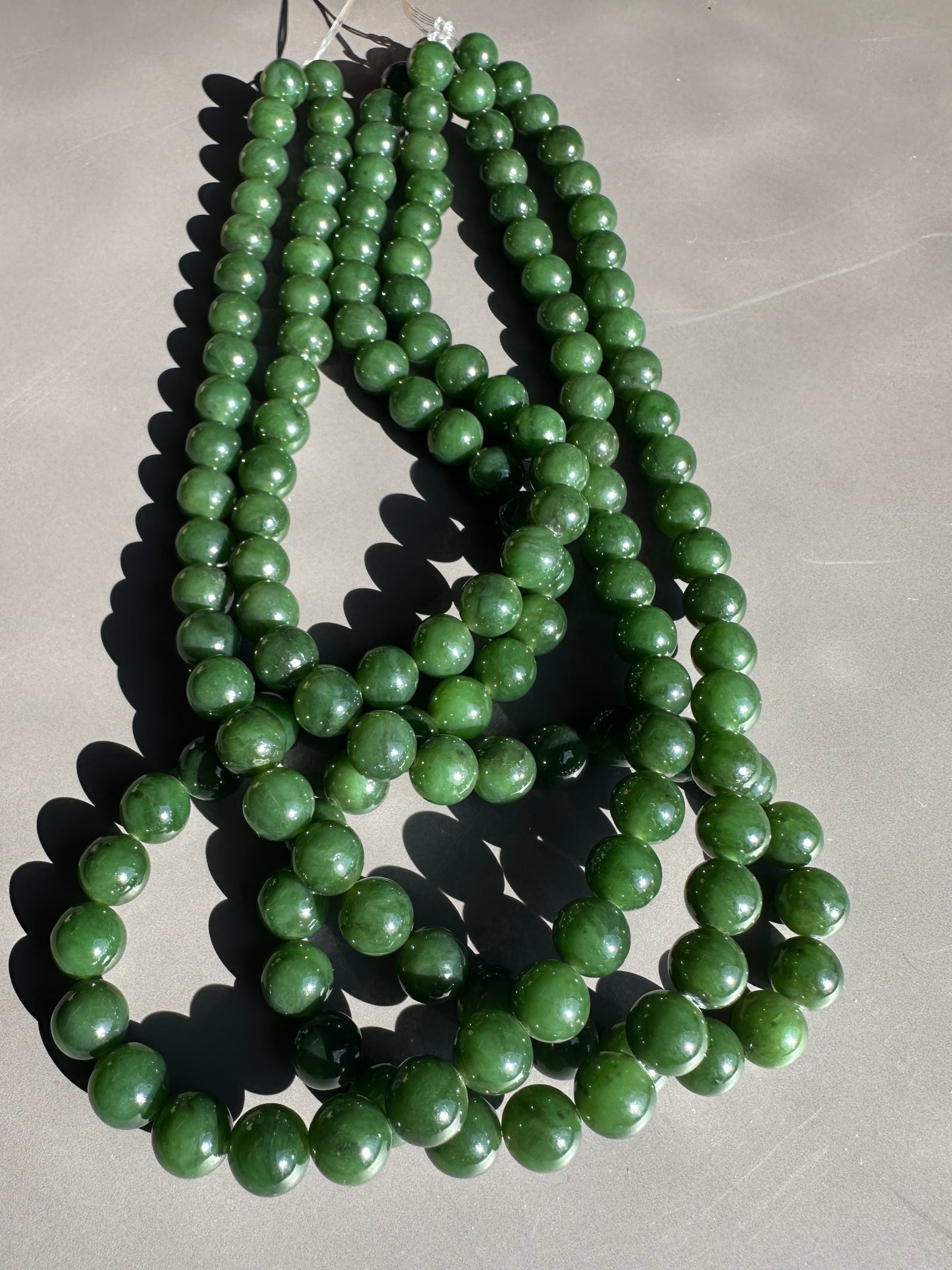 Dark green 8mm Canadian unstrung beads on 16 inch strands