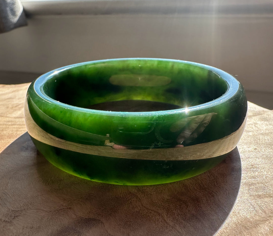 Canadian Jade Bangle with a central light beige band across the dark green jade