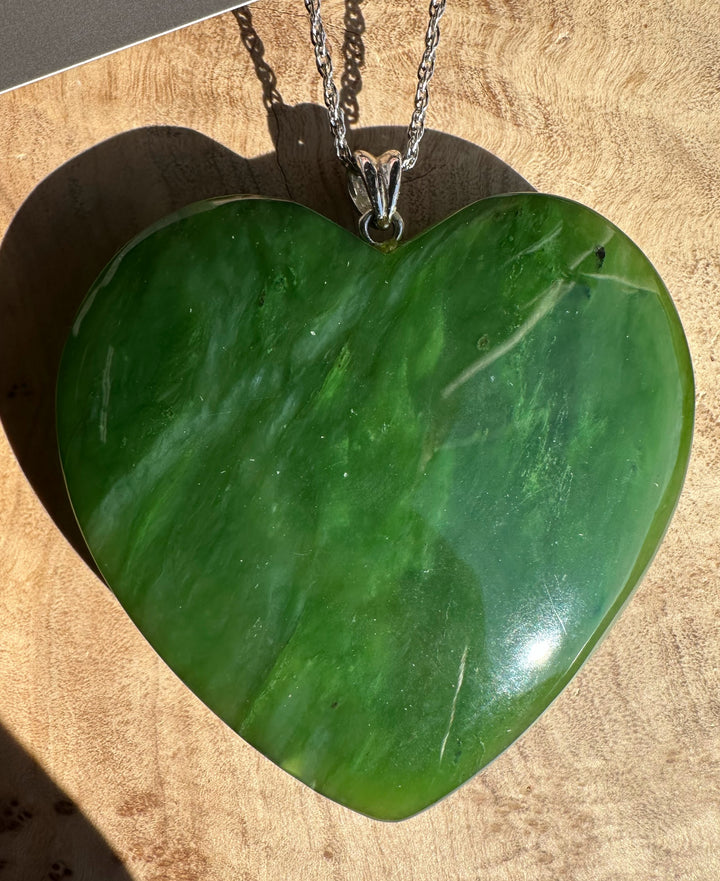 A+ Polar Jade large 2 inch heart pendant on a silver chain with a polished green surface