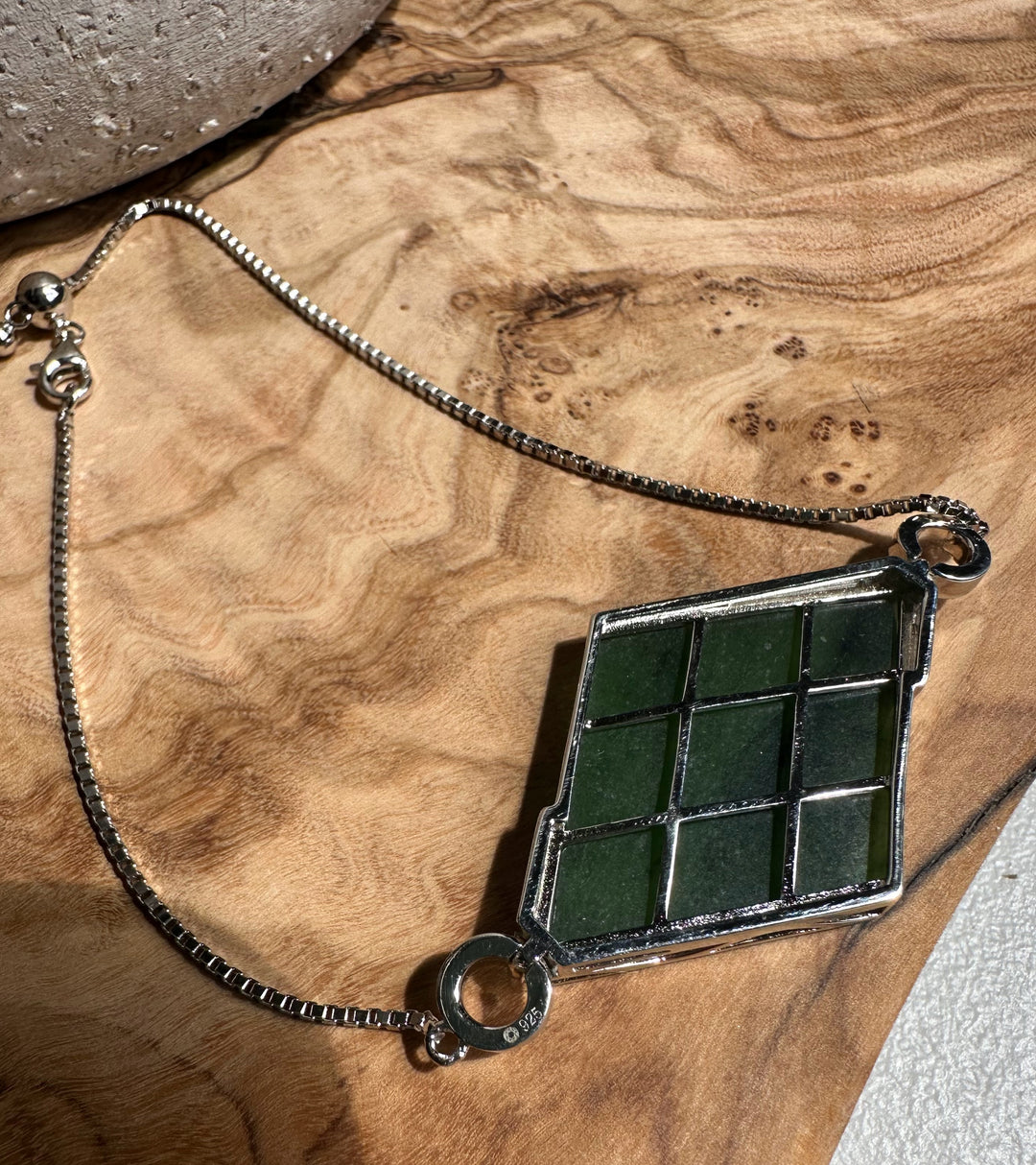 Sterling silver bracelet featuring a green Canadian Jade tile in a square silver frame
