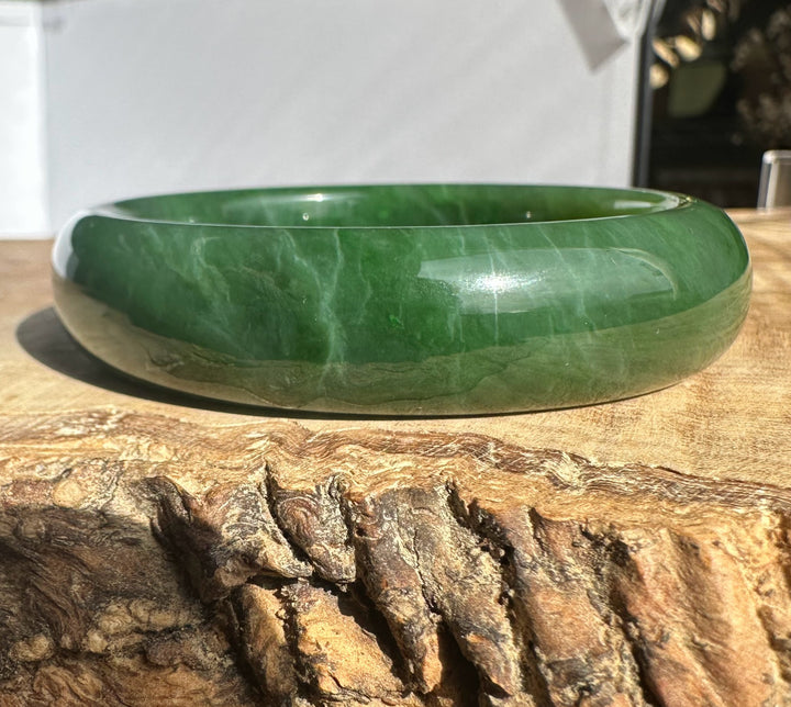 Canadian Jade Bangle 54.5 x 15mm in smooth green jade shown from the side to highlight the rounded edge