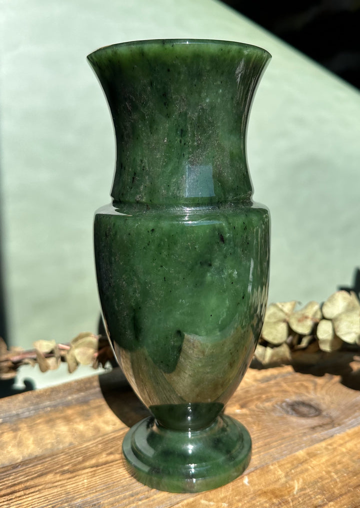 7.5 inch Siberian Jade Vase with flared rim and rounded body in deep green jade on a wooden surface