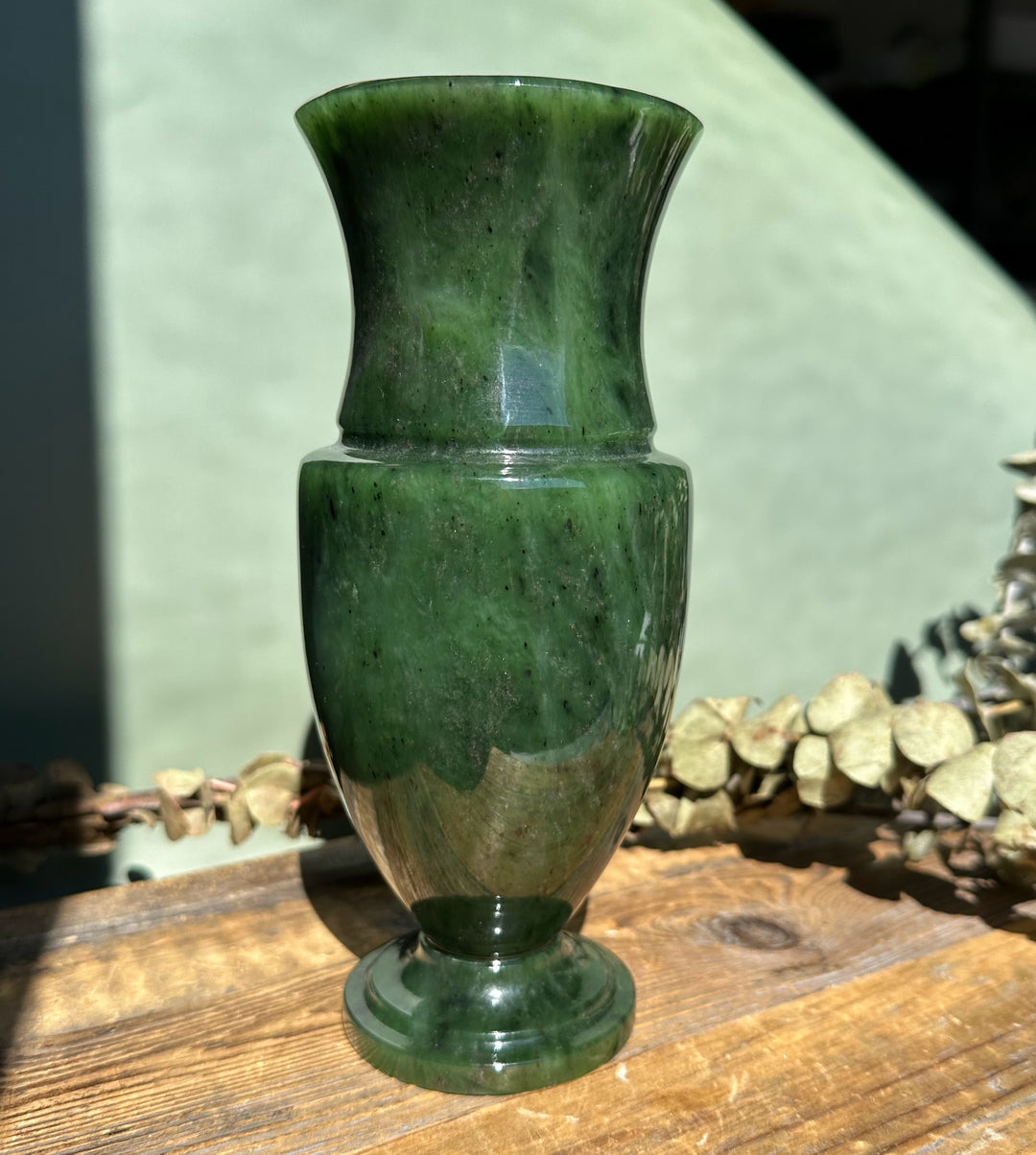 Siberian Jade Vase 7.5 inches tall with a wide flared neck and glossy green surface on wood
