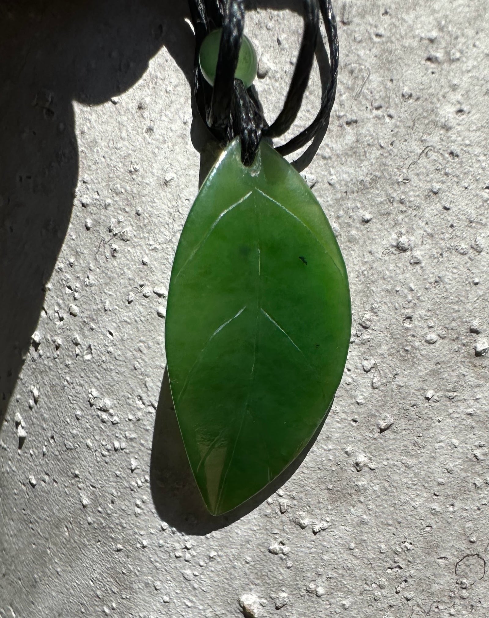 A+ Siberian Leaf Pendant 33mm green leaf pendant on a black cord with green beads