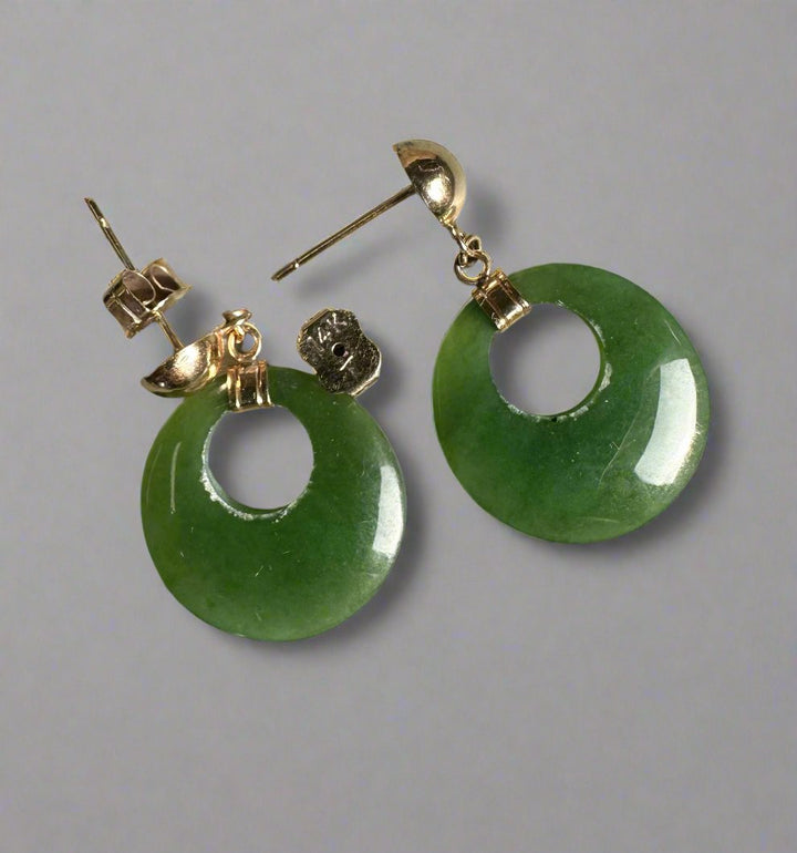 Green jade donut earrings with circular holes and gold findings