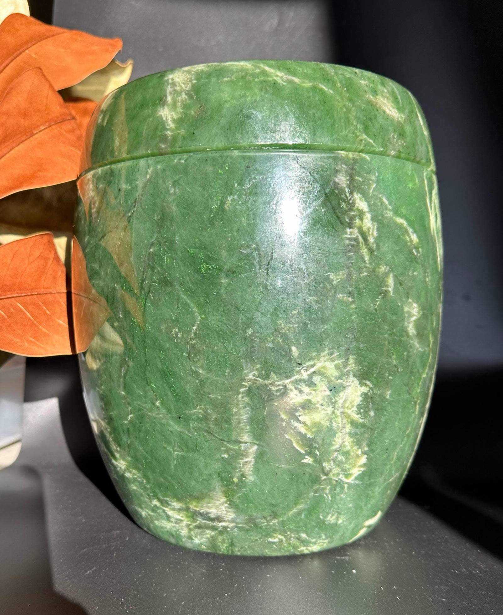 One of a kind green jade burial urn with a lid in a rounded cylindrical form