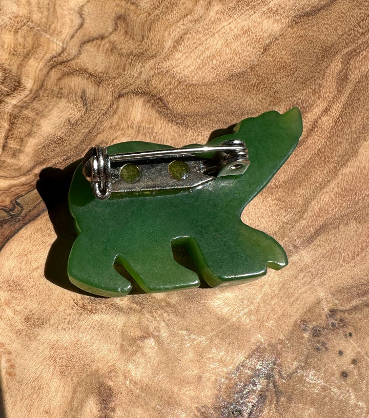 Back view of the green jade bear brooch showing the pin mechanism.