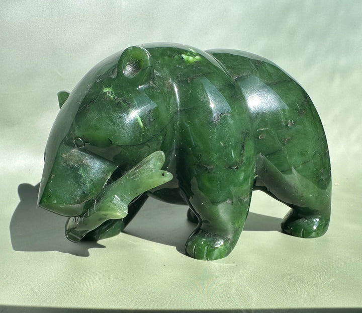 Canadian Jade Bear sculpture in emerald green jade with a polished surface.