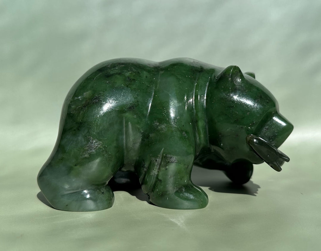 Side profile of a 5 inch Canadian Jade Bear carved from green jade with a glossy finish.