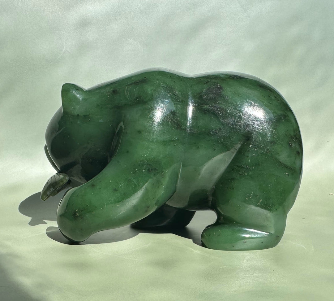 Three-quarter front view of the 5 inch Canadian Jade Bear sculpture in polished green jade.