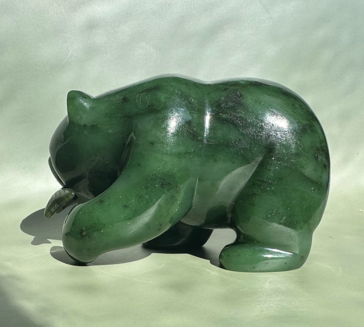 Three-quarter front view of the 5 inch Canadian Jade Bear sculpture in polished green jade.