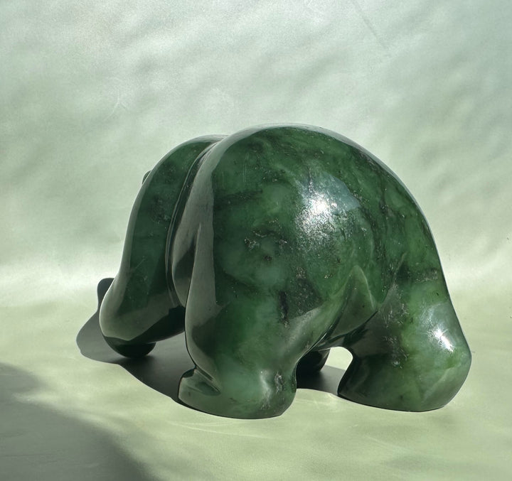 5 inch emerald jade bear sculpture viewed from behind in a crouching pose