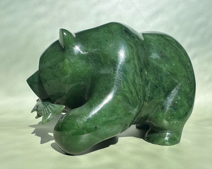 Side view of a 6-inch Canadian jade bear sculpture in glossy green.