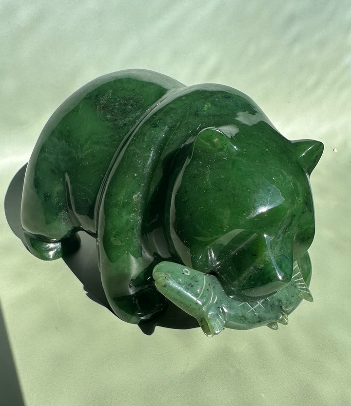 Canadian Jade Bear 6 inch sculpture viewed from above with a glossy dark green bear atop a rugged jade base.