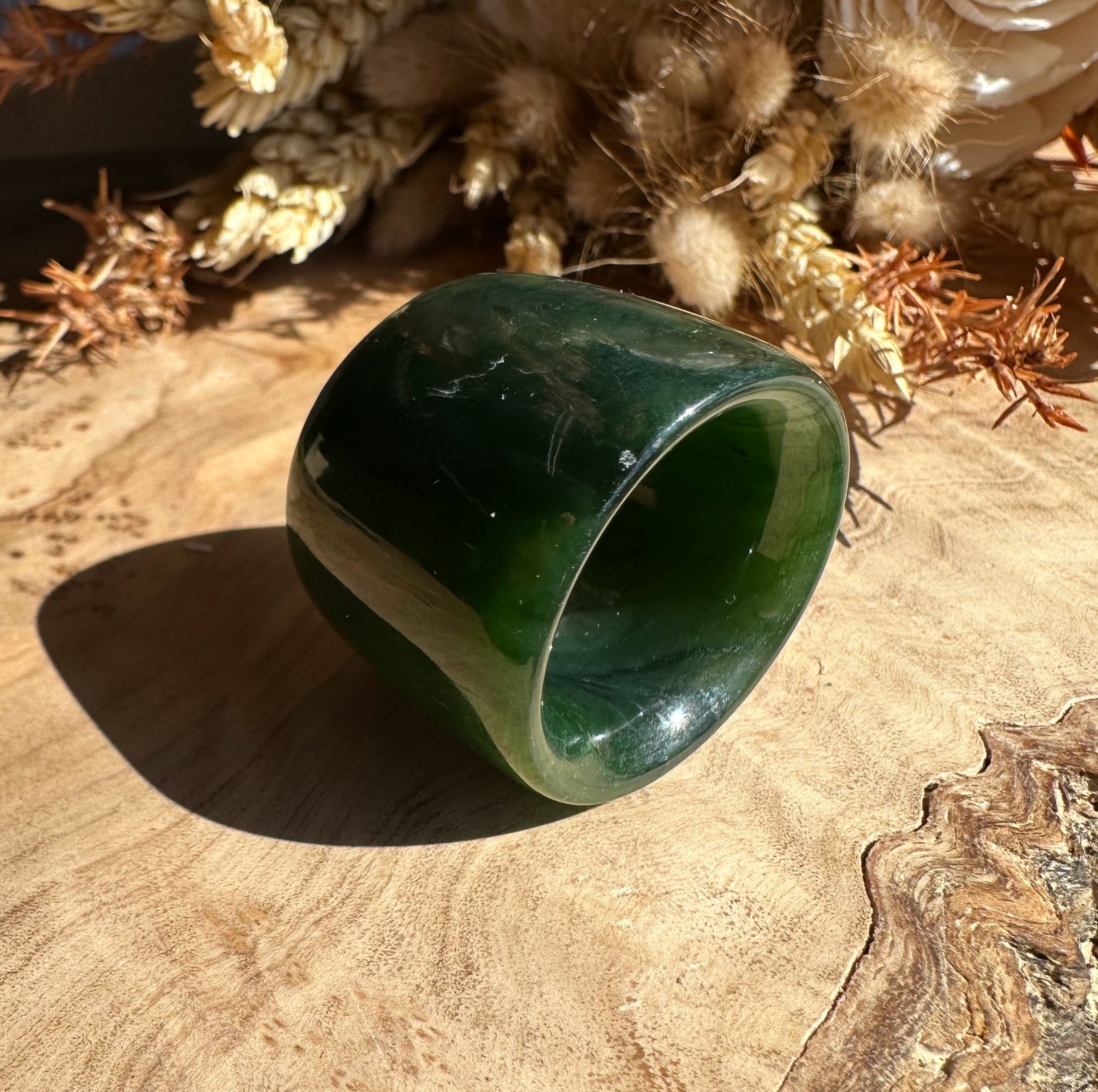 Canadian Ogden Jade Thumb Ring size 13 with a thick green band viewed from the side.