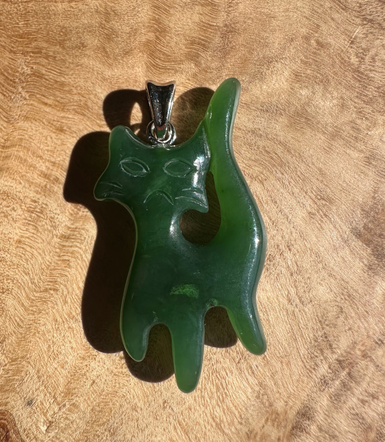Grumpy Canadian Jade Cat Pendant 34mm in dark green jade with a raised tail