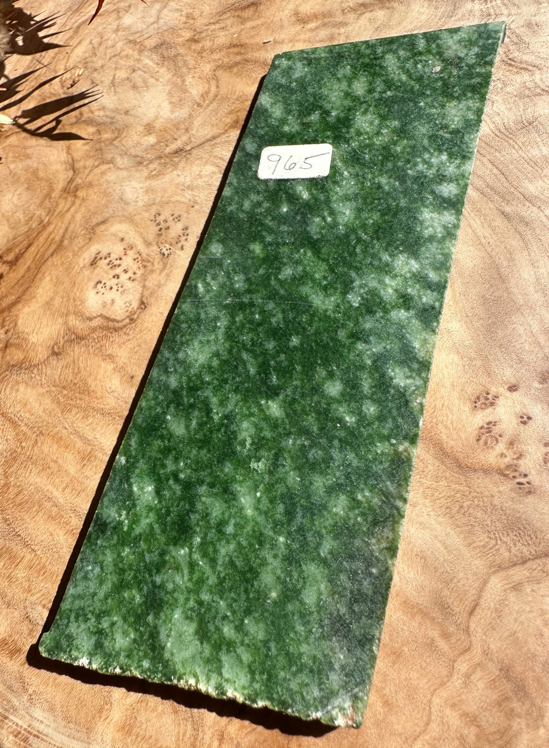 Wyoming Snowflake Jade Slab 95g on a wood surface with a white sticker reading 965