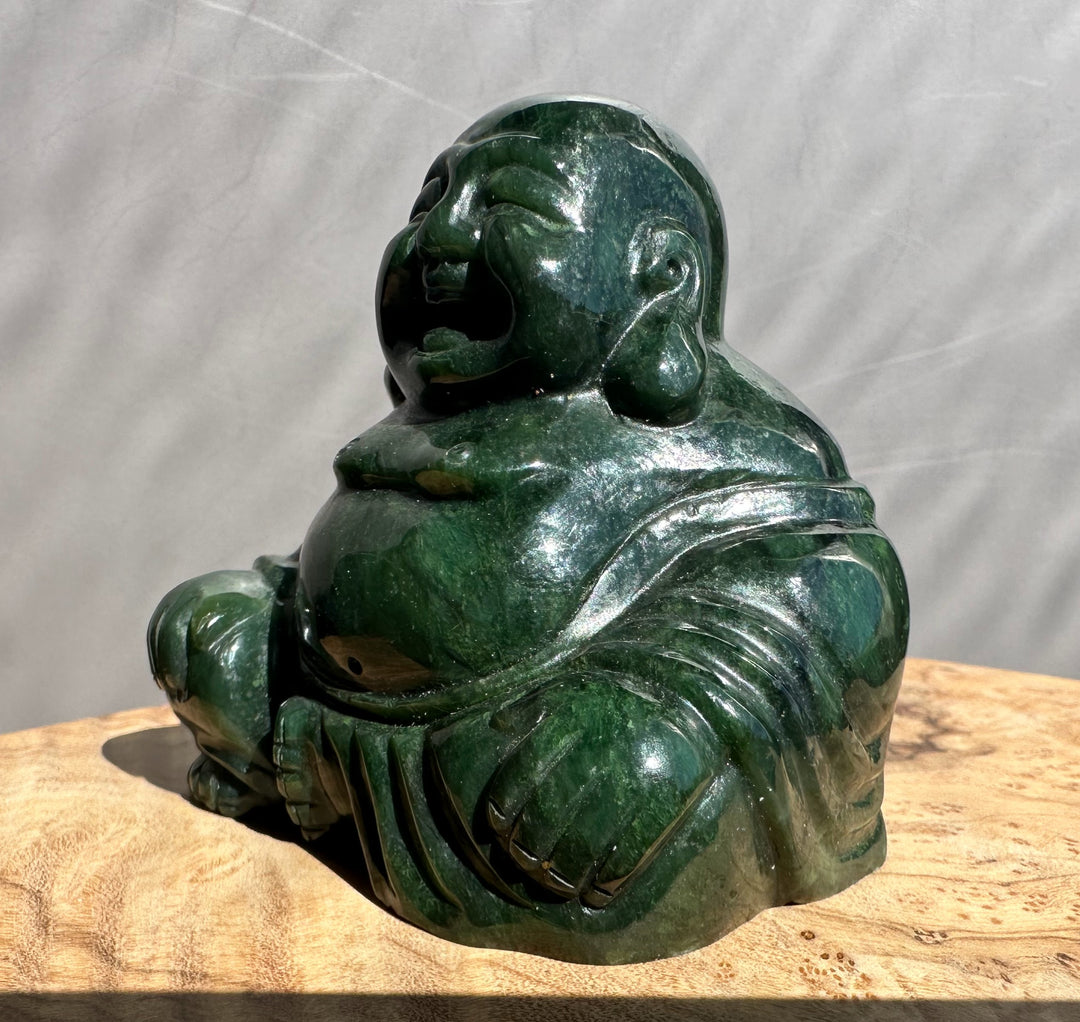 Dark green Happy Jade Buddha statue shown from the side with a glossy finish