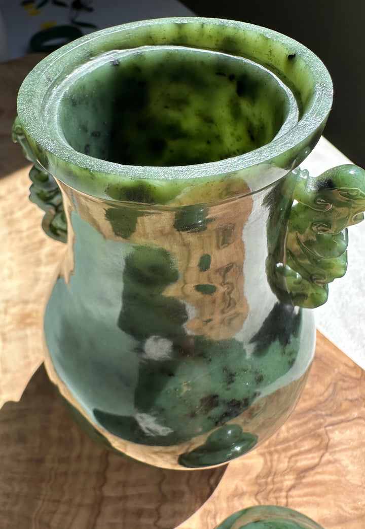 Side view of Canadian River Jade Vase with green variegated glaze and decorative handle.