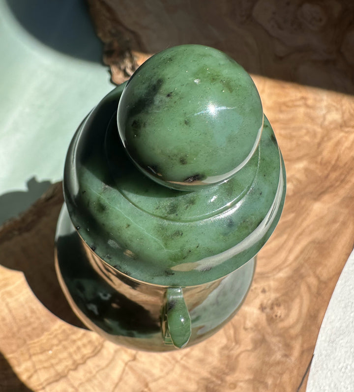 Top view of Canadian River Jade Vase with lid and knob, glossy green marblelike jade