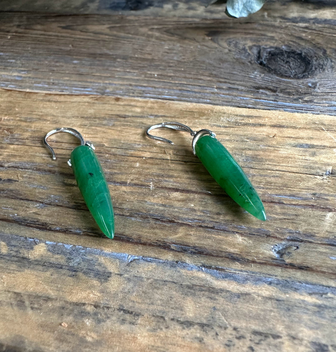 Pair of Canadian Jade Earrings JN3 green jade drops with silver hooks laid on weathered wood