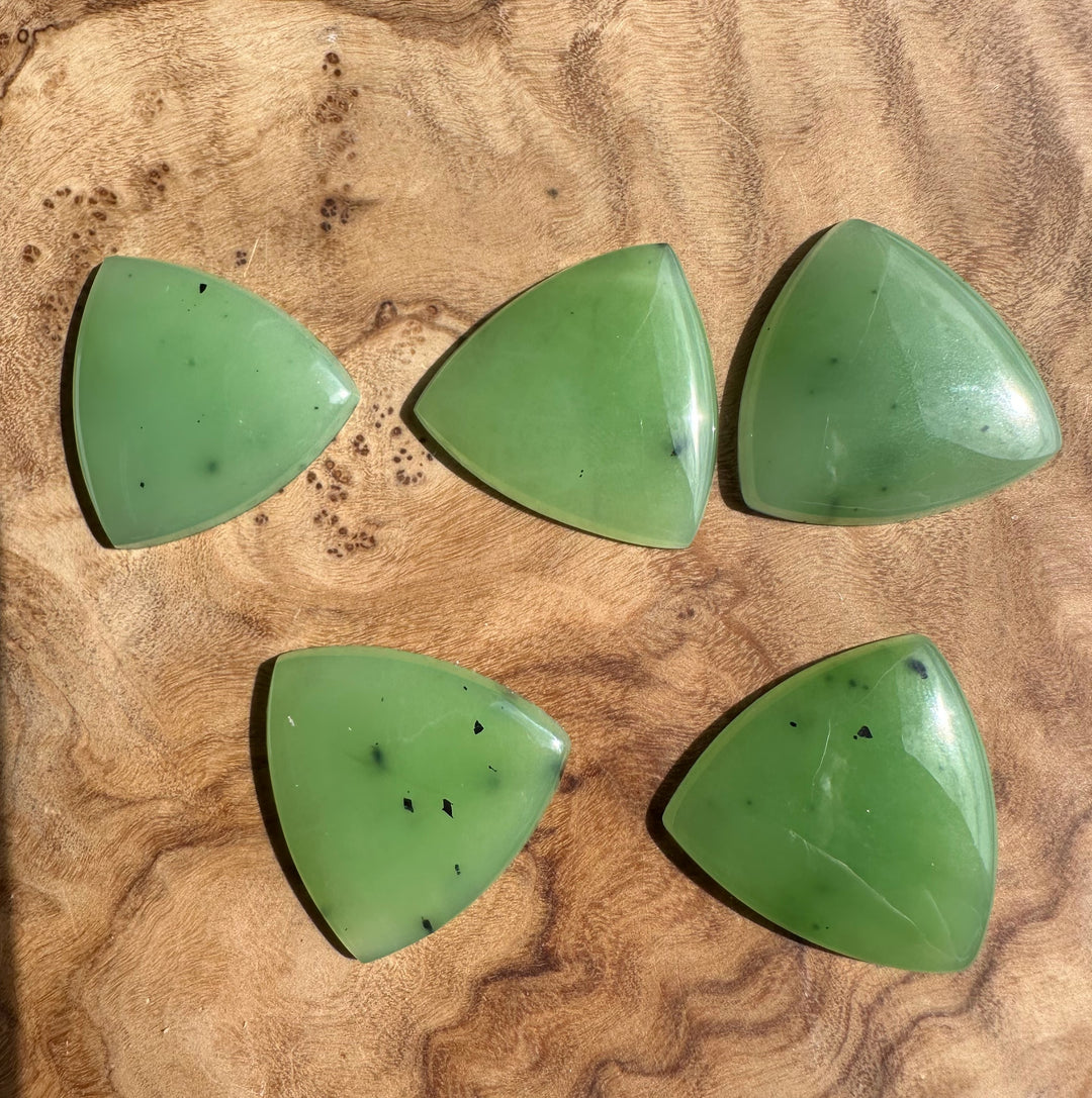 Apple Green Siberian Jade Cabochons 25x25mm  on wood surface