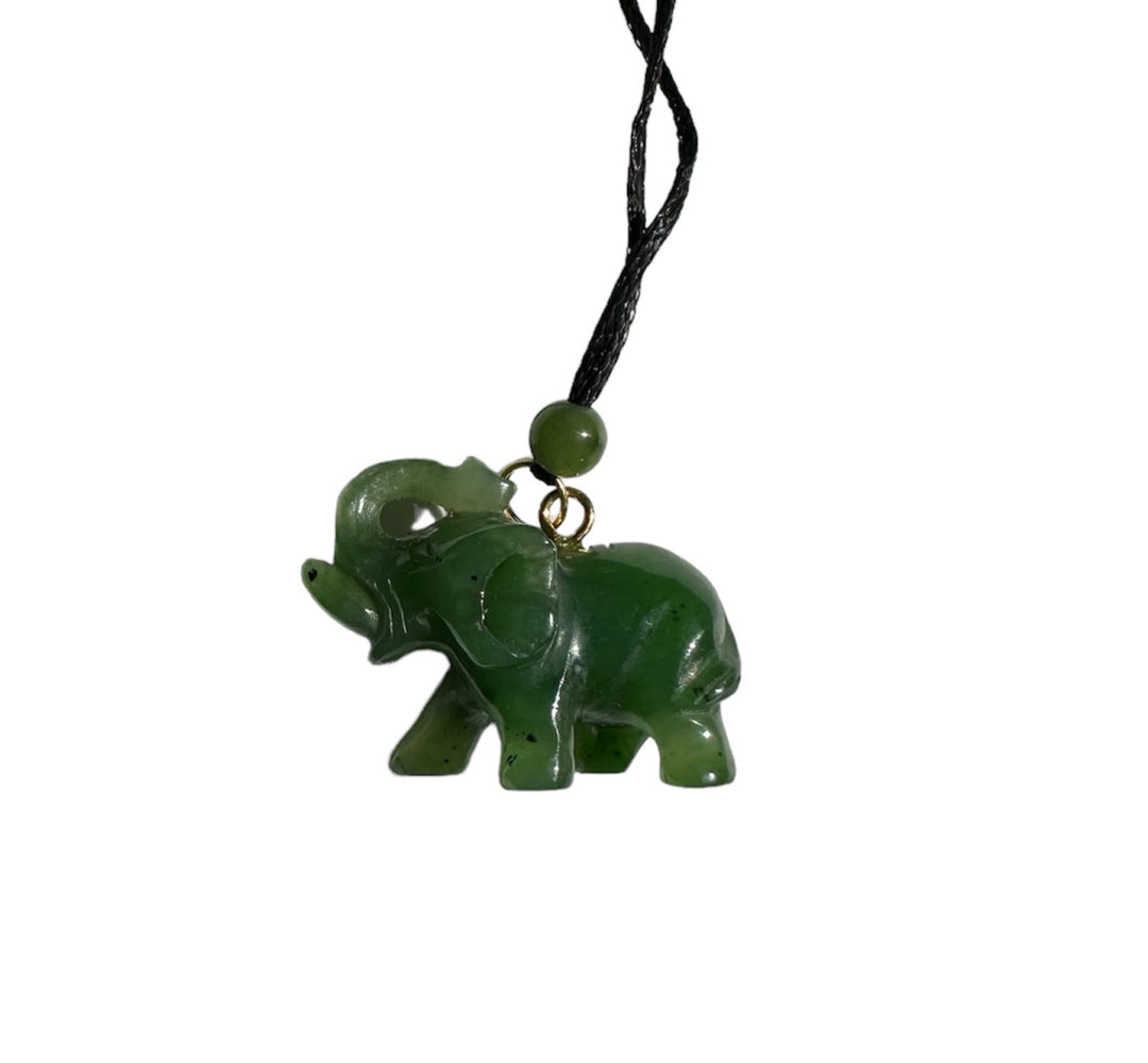 Green jade elephant pendant on a black cord necklace with a small green bead at the top