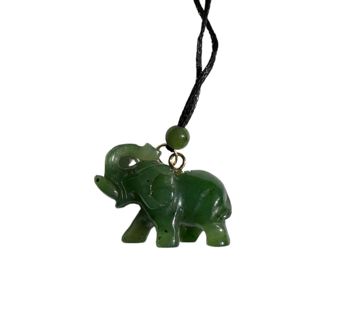 Green jade elephant pendant on a black cord necklace with a small green bead at the top