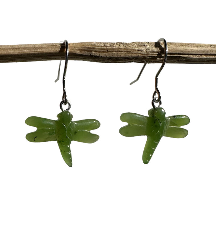 Pair of jade dragonfly earrings with green dragonfly charms on metal hooks.