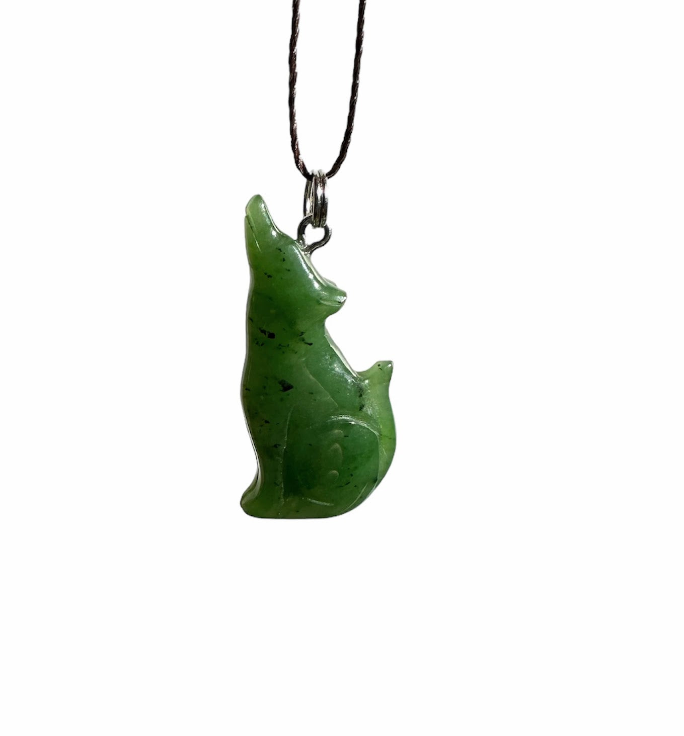 Green jade wolf pendant on a dark cord with a silver bail against a white background