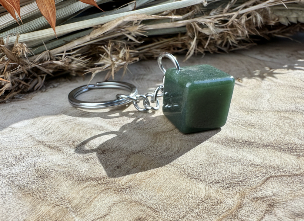 Cube shaped jade pendant on a silver keyring with chain